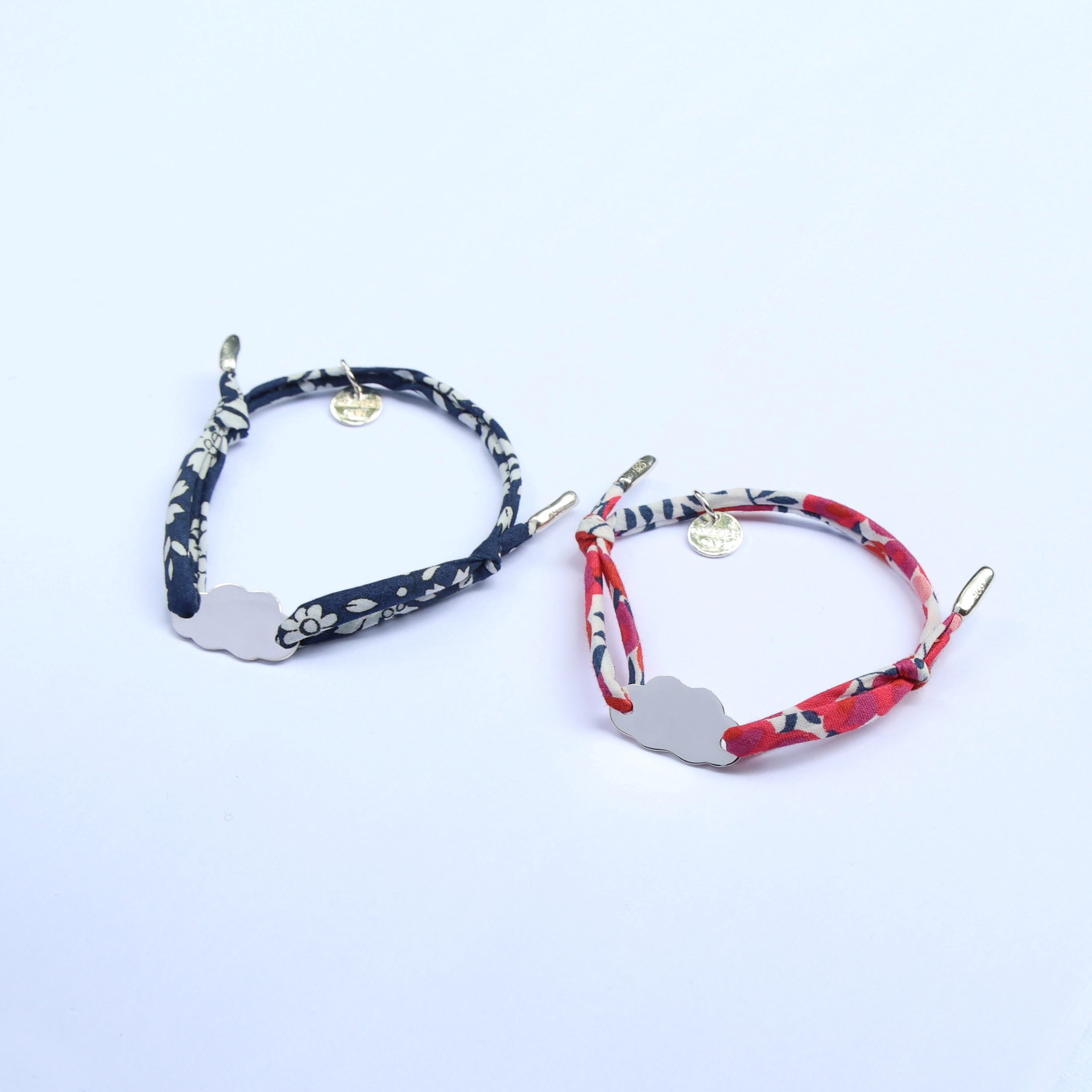 Little Ones bracelets matching set made of two colourful cord bracelets with sterling silver cloud pendants