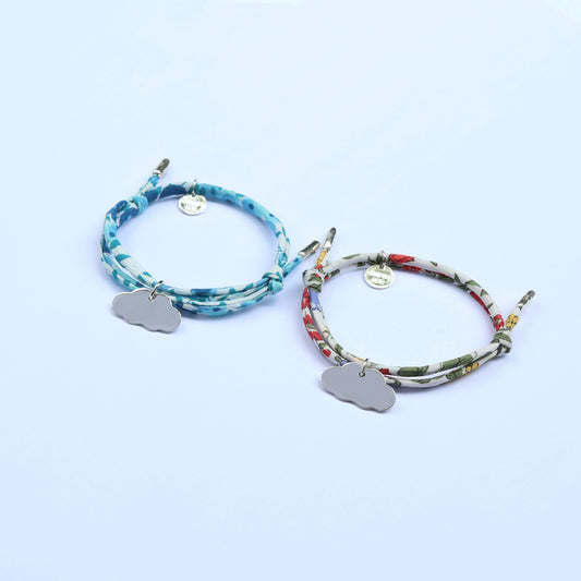 Two patterned cord bracelets with matching silver pendants, perfect for siblings 