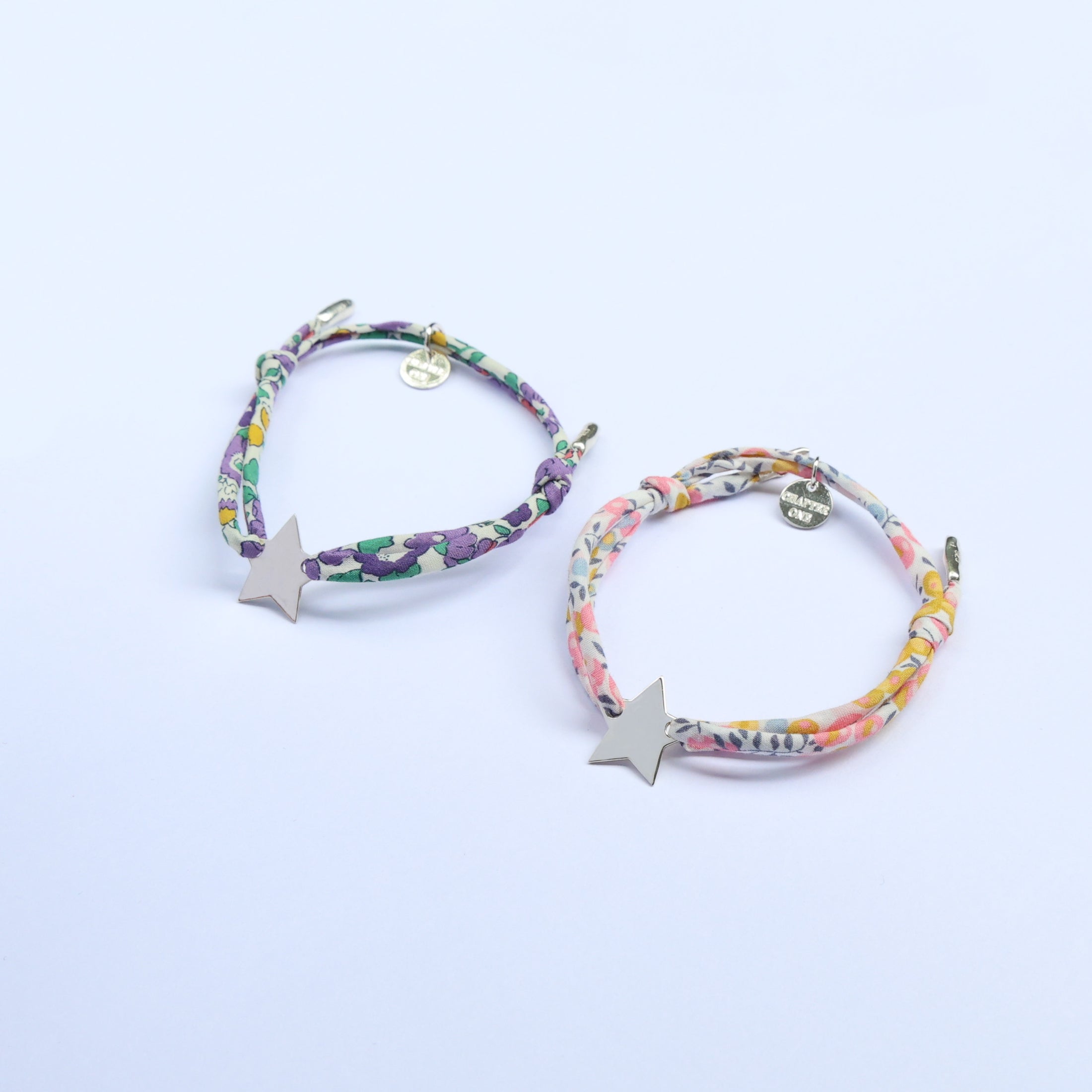 Two colorful bracelets with engravable star charms perfect for siblings, cousins, best friends