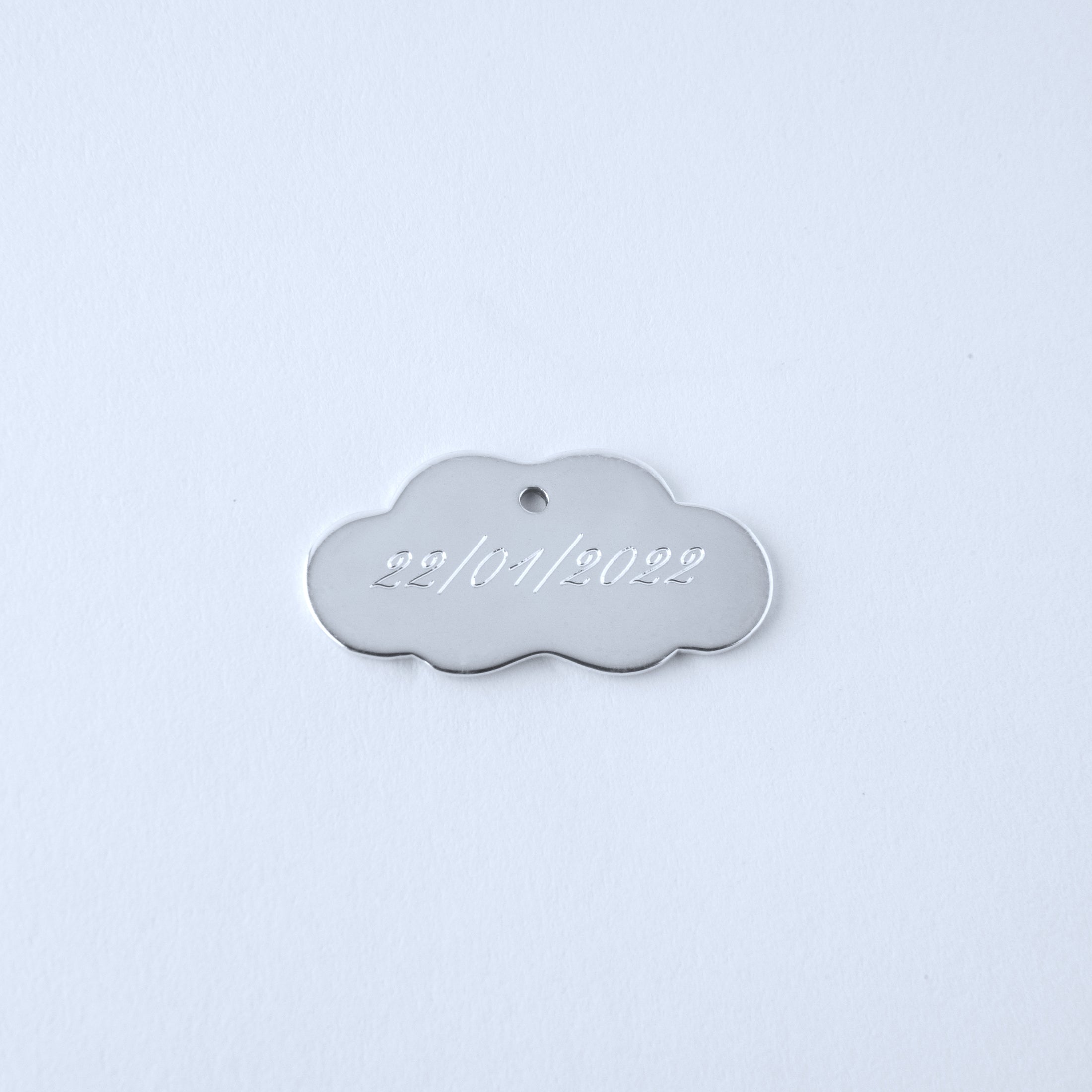 Silver cloud-shaped pendant engraved  with date 