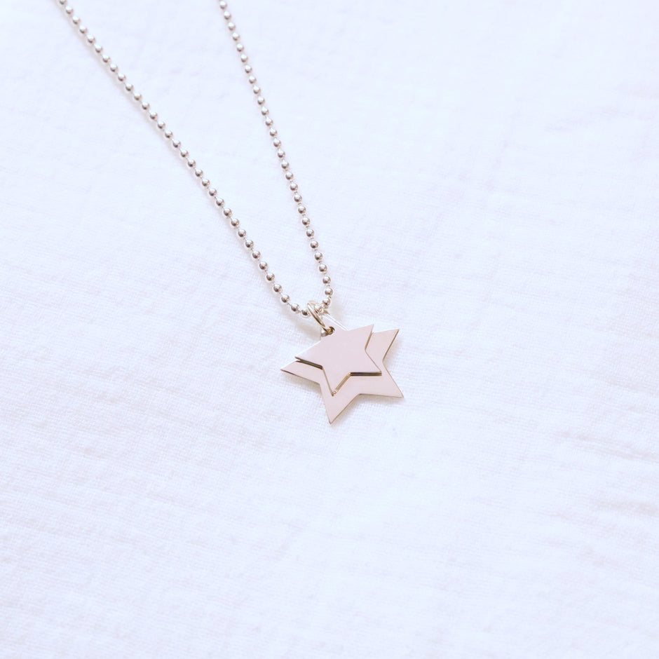 Silver Necklace with two Star Pendants layered on a silver bead chain
