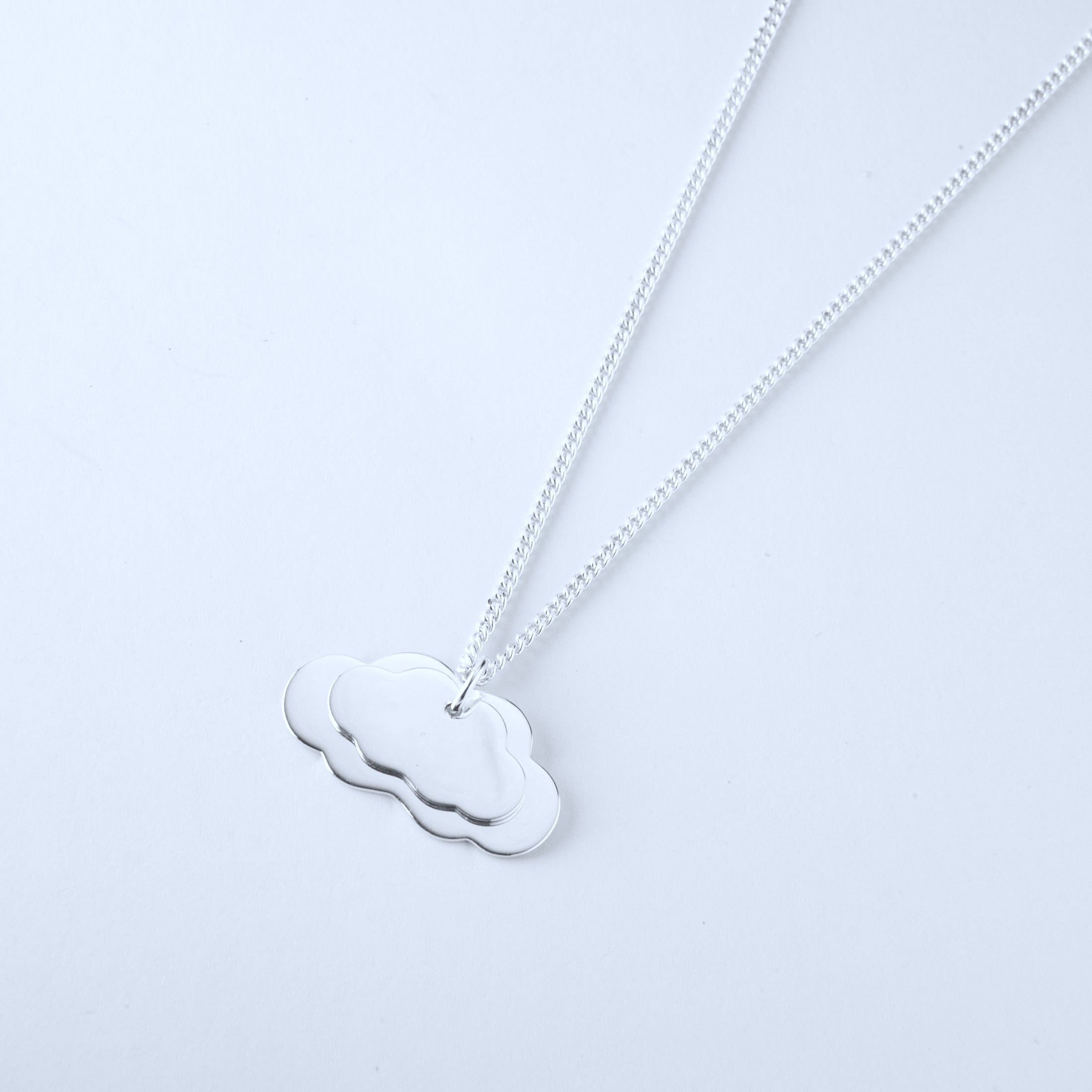 Silver cloud-shaped pendants on a silver chain 