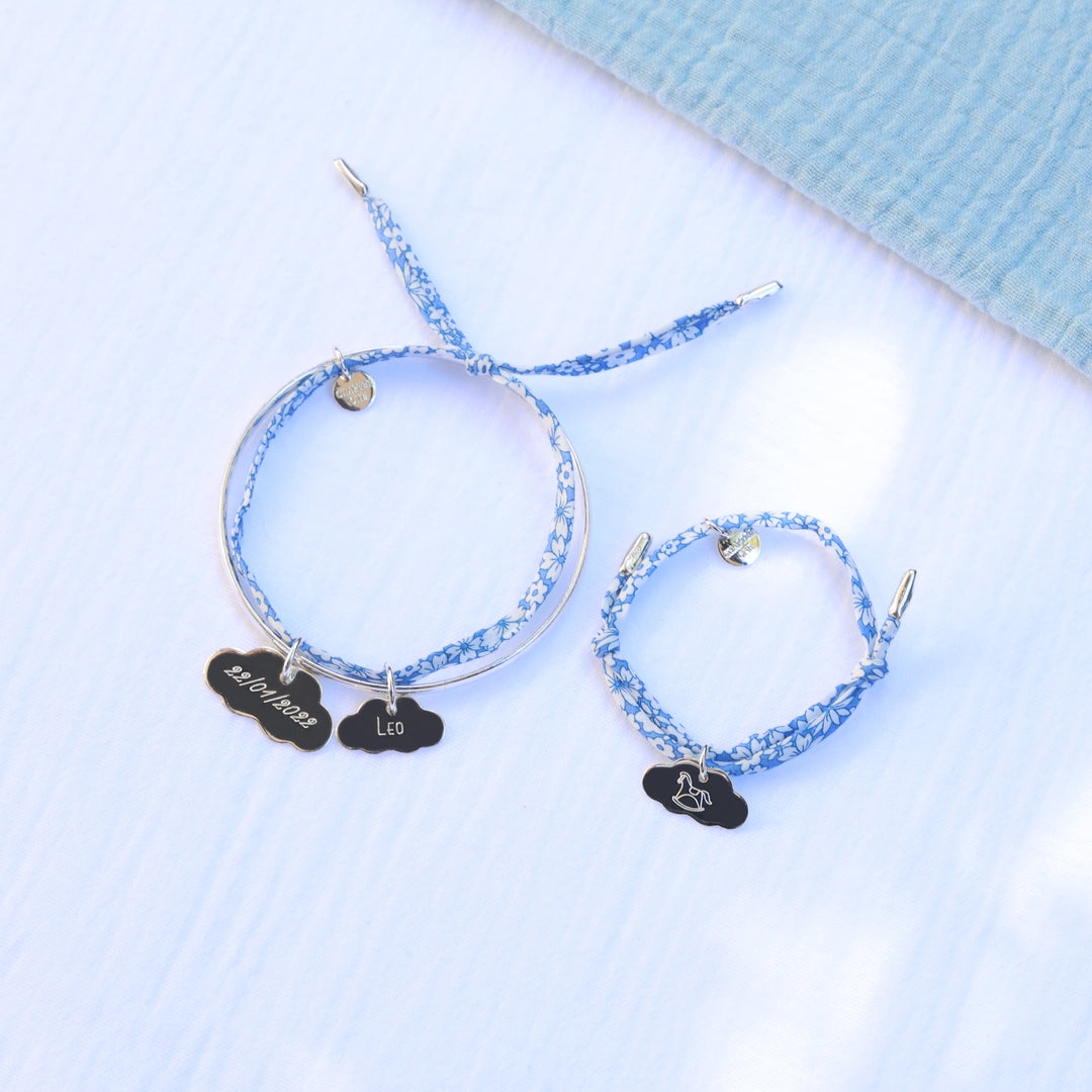 Mummy and me set made of a woman bangle and a child bracelet with personalised silver charms.