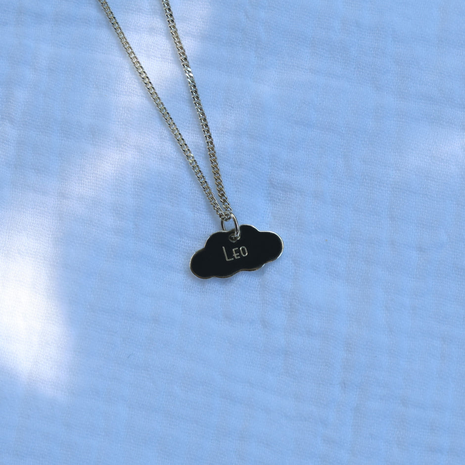 Sterling silver necklace with a cloud-shaped pendant engraved with a name