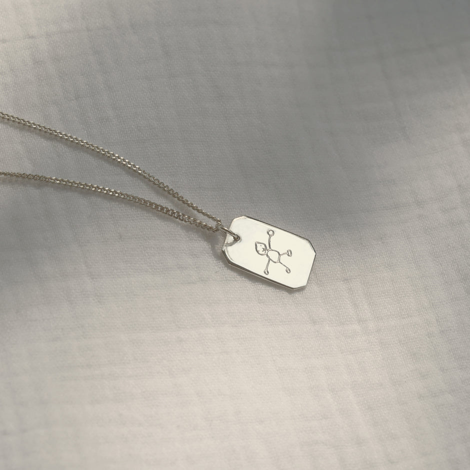 Silver necklace with a bar pendant personalised with a drawing