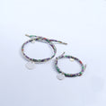 Load image into Gallery viewer, Mummy and me set, made of one silver bangle an one cord bracelet with round pendants and colourful ribbons.
