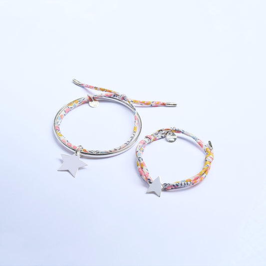Mummy and me set composed of one silver bangle and one cord bracelet both with matching star pendants