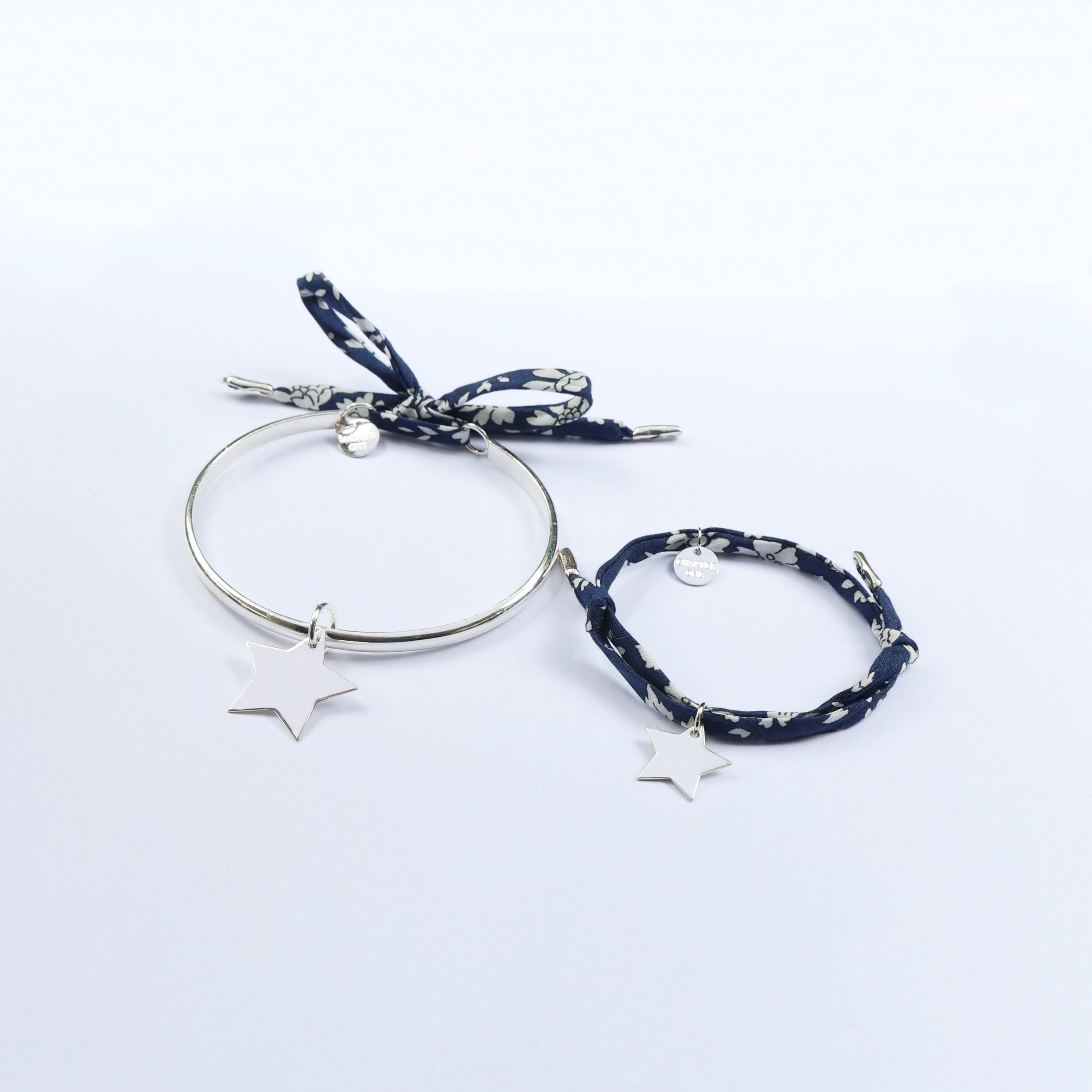 Mummy and me bracelets matching set with one silver bangle and one cord bracelet with star pendants