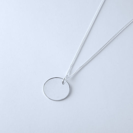 Silver necklace with a round pendant