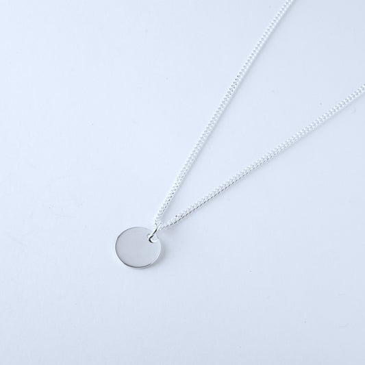 Silver necklace with a round pendant for women and children