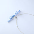 Load image into Gallery viewer, Silver necklace with a blue floral pattern bow
