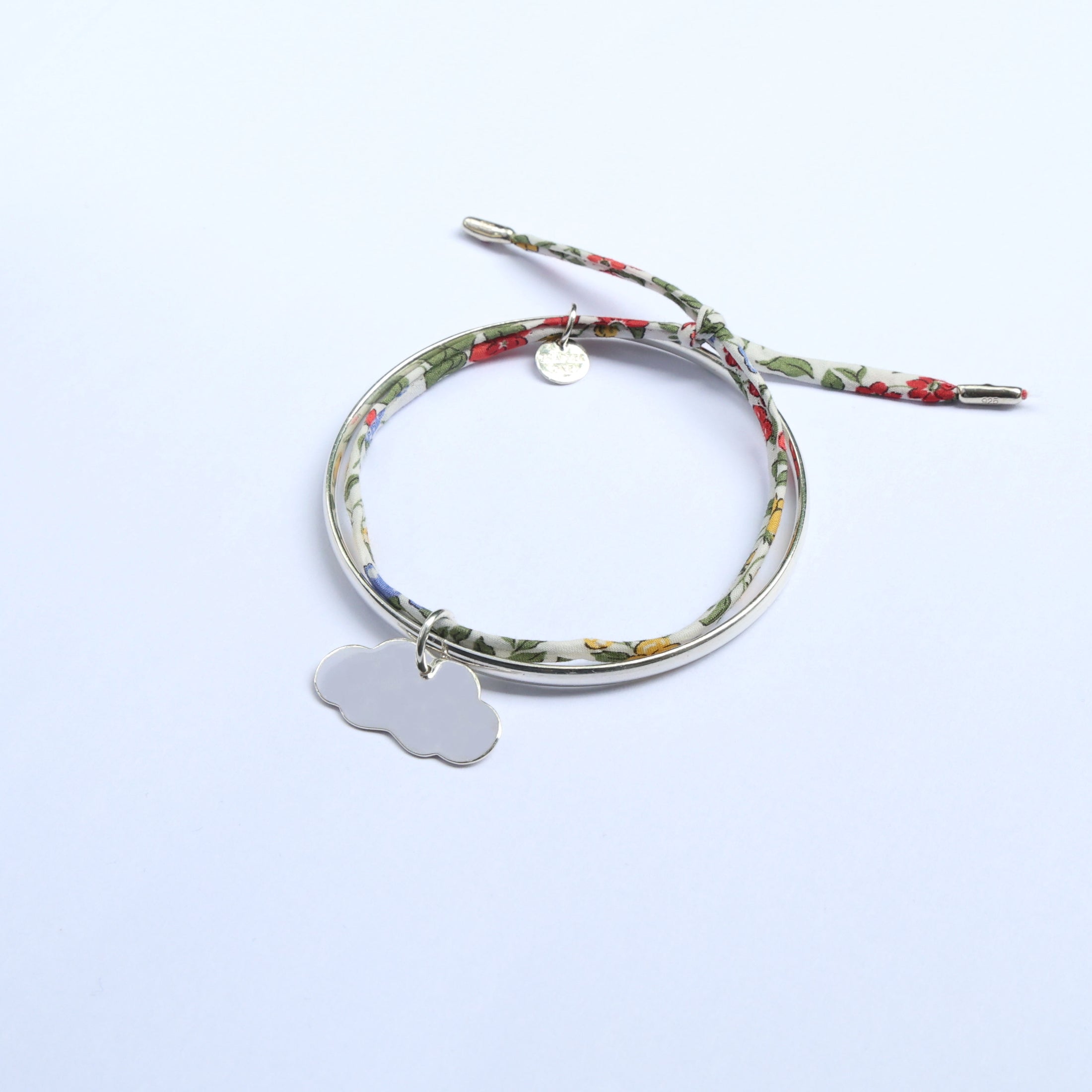 Sterling silver bangle for women with cloud shape pendant.