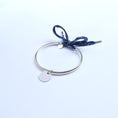Load image into Gallery viewer, Silver bracelet with engravable round pendants and blue fabric
